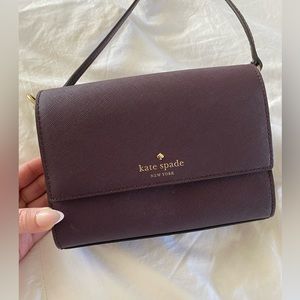Kate Spade Flap Closure Cross Body in Wine with a small cloth bag